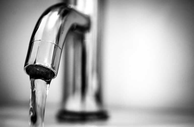 repairman-app-up-close-running-faucet